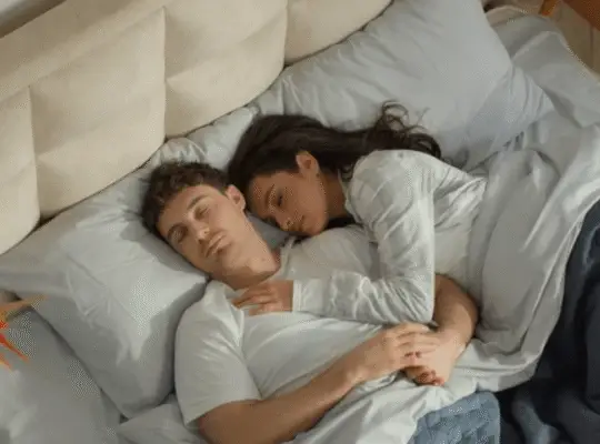 Couple sharing bed peacefully, showing sleeping intimacy as explored by a sleeping scientist