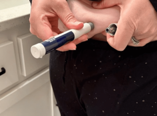 Person preparing GLP-1 weight loss injection pen medication for weekly self-administration