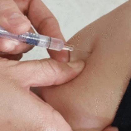 Healthcare professional administering baby vaccination using gentle ways to minimize discomfort during immunization