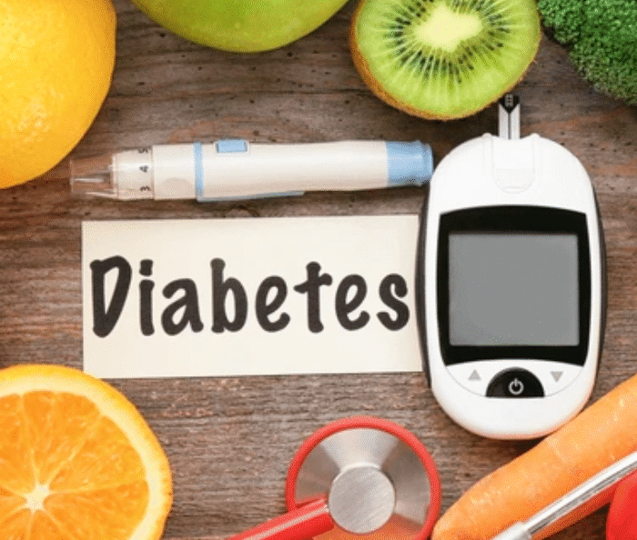 Diabetes management concept with blood glucose meter, healthy foods, and stethoscope showing foods that affect blood sugar levels